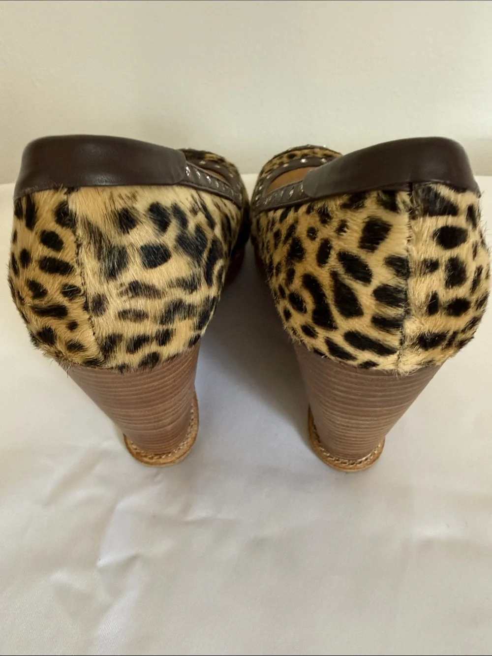 Animal print wedges with rhinestone trim. Leather upper size 8.